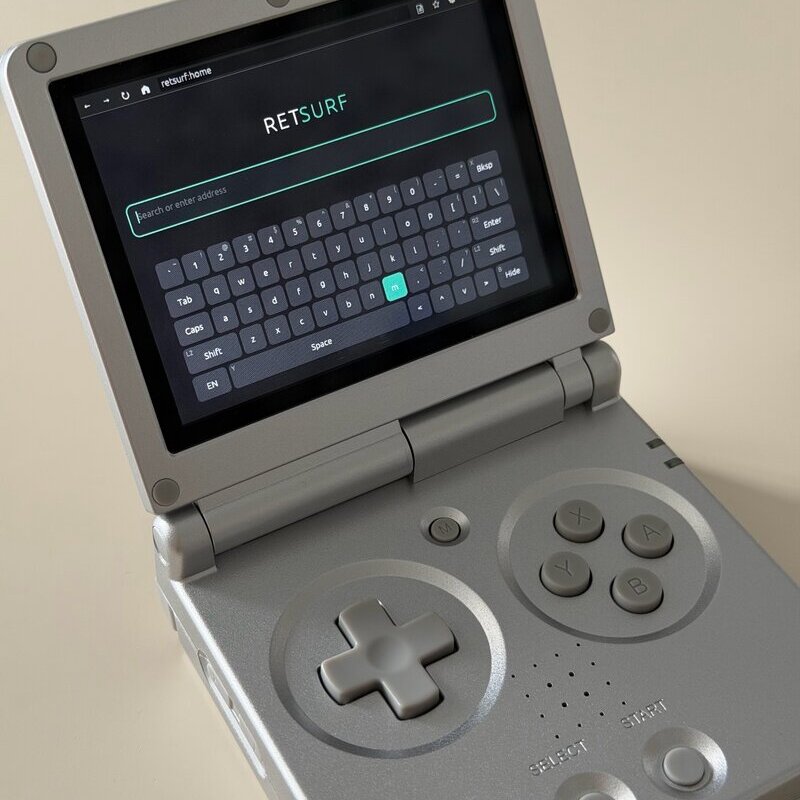 retsurf on an Anbernic RG35XX SP, the on-screen keyboard raised under the address field